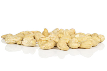 Lot of whole brown nut cashew isolated on white background