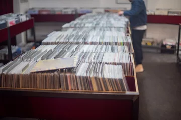 Washable wall murals Music store Selective focus of man searching through records at local music store