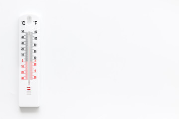 Weather thermometer on white background top view copy space