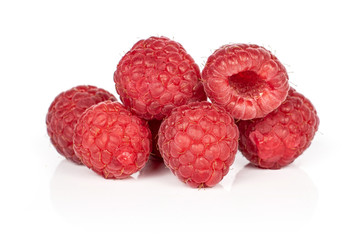 Group of six whole fresh red raspberry isolated on white background