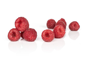 Group of nine whole fresh red raspberry isolated on white background