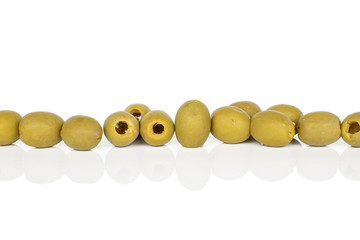 Lot of whole marinated green olive in row isolated on white background