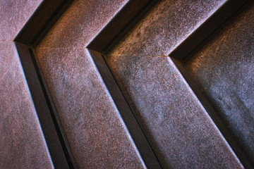 Close-up of grooves in modern iron metal structure forming an industrial texture background
