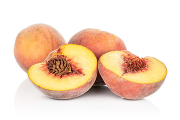Group of two whole two halves of sweet red peach isolated on white background