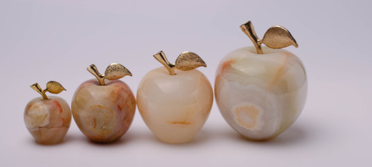 photo marble apples in the form of a family of one to four