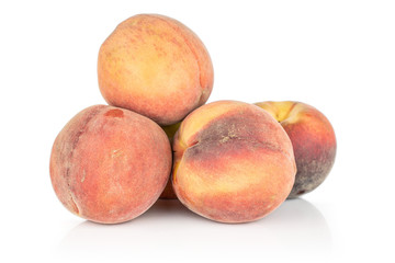 Group of four whole sweet red peach isolated on white background