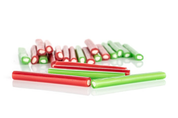 Lot of whole sweet stick candy front focus isolated on white background