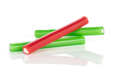 Group of three whole sweet stick candy isolated on white background