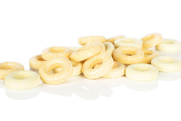 Lot of whole bright round pale yellow candy front focus isolated on white background