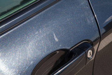 the metal surface of the car and headlight. Blue Pearl paint on the car