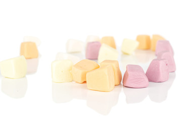 Lot of whole disordered soft pastel candy isolated on white background