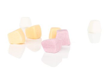 Group of seven whole soft pastel candy isolated on white background