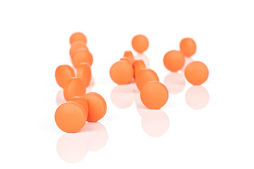 Lot of whole orange tablet pharmacy isolated on white background