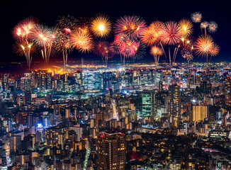 Fireworks over Tokyo cityscape at night, Japan