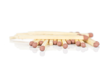 Lot of whole brown safety match isolated on white background