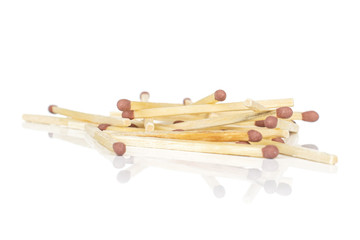 Lot of whole brown safety match heap isolated on white background