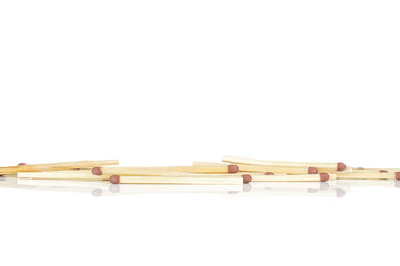 Lot of whole brown safety match in row isolated on white background