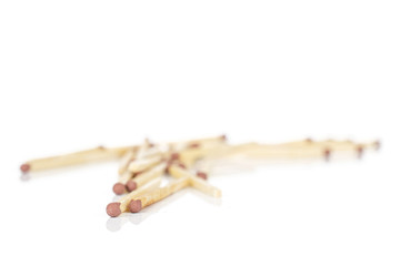 Lot of whole disordered brown safety match isolated on white background