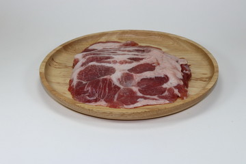 Fresh organic neck pork for Shabu or Sukiyaki and barbecue on the wood plate. Fat and unhealthy ingredients. Famous raw meat in Asia. 