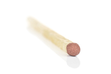 One whole brown safety match macro isolated on white background