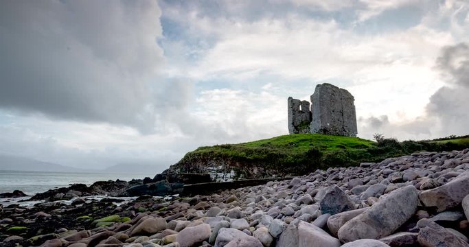 timelapse footage of the coastline in southern ireland on the dingle peninsula showing minard castle at sunset