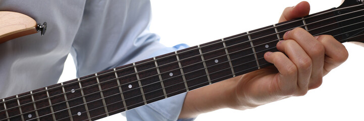 Male arms playing classic shape electric guitar