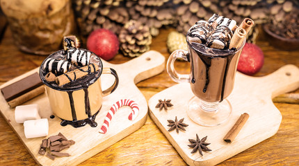 Two cups of hot chocolate decorated for Christmas. Typical holiday drink during the American and European winter.