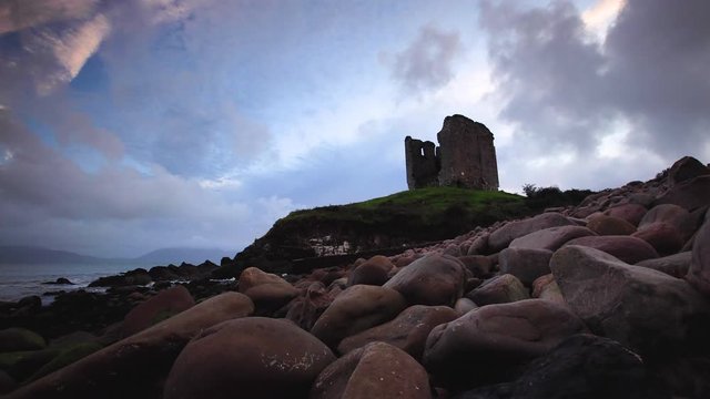 timelapse footage of the coastline in southern ireland on the dingle peninsula showing minard castle at sunset