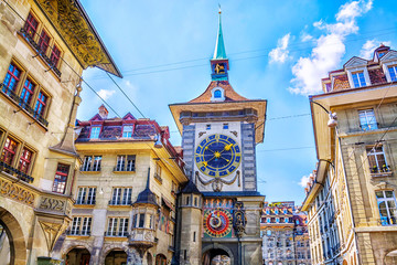 Astronomical clock on the medieval Zytglogge clock tower in Kramgasse street in old city center of Bern, Switzerland - obrazy, fototapety, plakaty