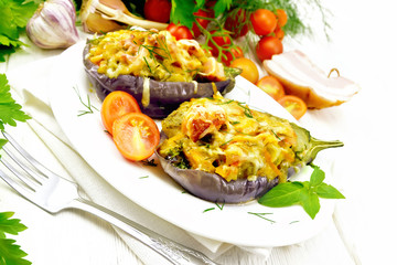 Eggplant stuffed smoked brisket and vegetables in plate on board