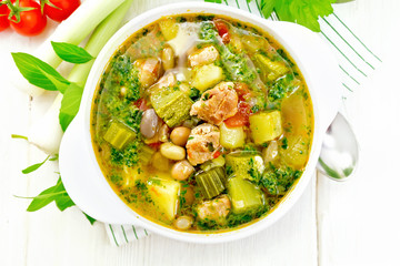 Soup with pisto sauce in bowl on board top