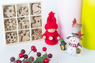 Christmas card with candles and Christmas set of toys with a branch of berries