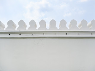 White wall of the Grand Palace with blue sky as background, Bangkok Thailand © YUU-ME