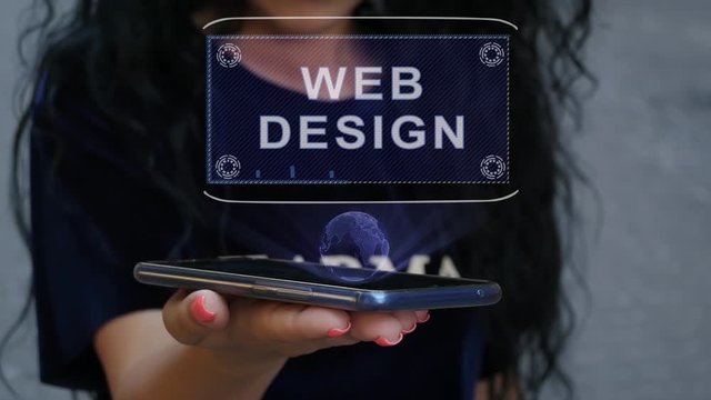 Unrecognizable curly brunette woman showing HUD hologram with text Web Design. Girl uses technology of the future on a mobile screen