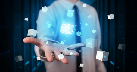 Person holding hologram projection displaying white cubes in server room