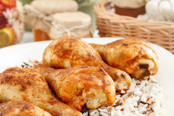 Indian cuisine: roasted chicken with rice and vegetables.