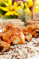 Indian cuisine: roasted chicken with rice and vegetables.