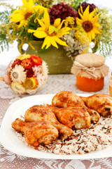 Indian cuisine: roasted chicken with rice and vegetables.