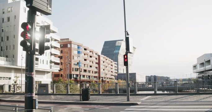Cinema 4K gimbal wide shot with slide motion of traffic lights, Oslo Opera House and the Edvard Munch museum Lambda in the Bj&oslash;rvika Opera quarter, in Oslo Norway.