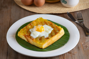 Traditional Malaysian style breakfast, kaya butter toast with half boiled eggs