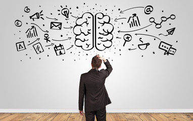 Angry manager looking to wall with drawn overloaded brain concept