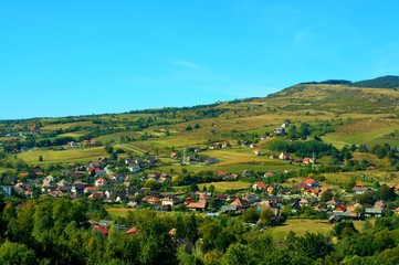 landscape with a village between the hills of Transylvania