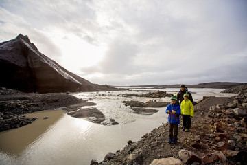 Fototapeta premium Father with children, walking on a path in beautiful nature of Skaftafell Glacier national park on a gorgeous autumn day