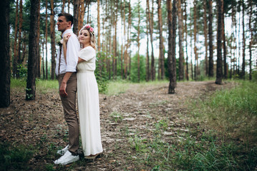 Beautiful wedding couple in a forest