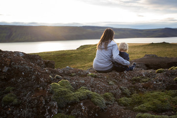Family posing in Geothermal area in Reykjanesfolkvangur, enjoying the view of a splendid nature in Iceland