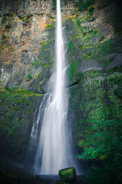 Artistic Slow Shutter Waterfall on Mossy Green Rocks