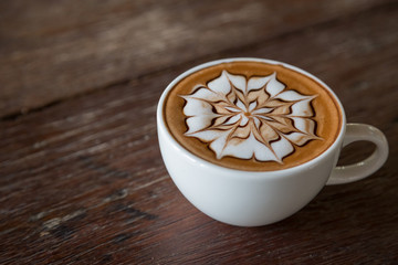 Cup of coffee with  latte art on top
