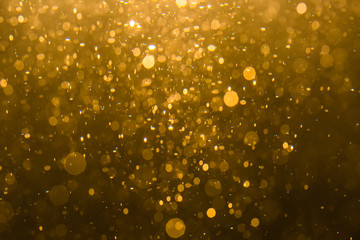 Abstract gold bokeh with black
