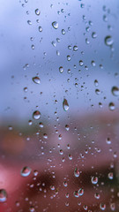 water or rain droplets on glass window. selective focus. narrow depth of field