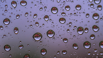 water or rain droplets on glass window. selective focus. narrow depth of field